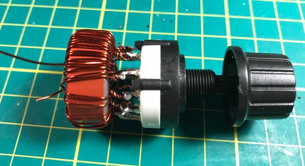 Rotary switch with toroid assembly